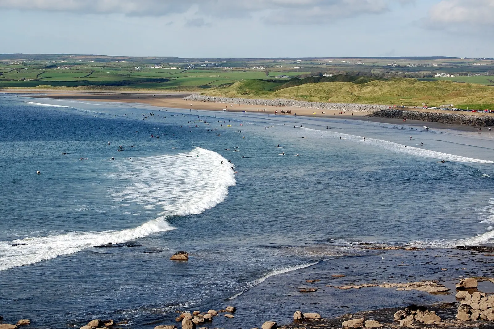 Waves rolling onto the long sandy beach at Lahinch