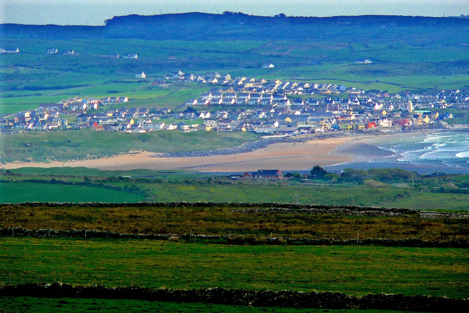 Lahinch town and beach seen across the bay from the Cliffs of Moher